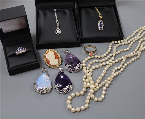 A group of assorted mainly costume jewellery including cultured pearl necklace, rings and pendants including tanzanite and bracelet